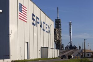 As a Falcon 9 rocket stands ready for liftoff at the Kennedy Space Center's Launch Complex 39A. The rocket will boost a Dragon resupply spacecraft to the International Space Station, 14 August 2017.