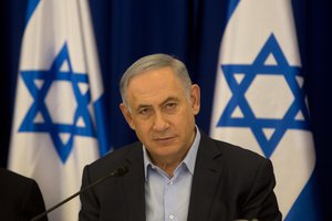 Israeli Prime Minister Benjamin Netanyahu chairs the weekly cabinet meeting in the Israeli controlled Golan Heights, Sunday, April 17, 2016.