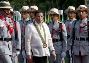 President Rodrigo Duterte reviews the troops during the 121st anniversary celebration of the Philippine Army Tuesday, March 20, 2018, in Taguig city, east of Manila, Philippines.