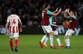 Happy returns: West Ham United's Andy Carroll (centre) celebrates scoring the equaliser.