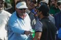 Driven to drink: Jason Day collects his ball out of a fan's beer cup.