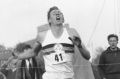 Roger Bannister hits the tape to break the four-minute mile in Oxford, England.