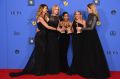 Laura Dern, from left, Nicole Kidman, Zoe Kravitz, Reese Witherspoon and Shailene Woodley pose in the press room with ...