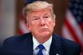 President Donald Trump listens during a dinner with European business leaders at the World Economic Forum, Thursday, ...