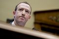 Mark Zuckerberg, chief executive officer and founder of Facebook Inc., pauses while speaking during a House Energy and ...