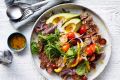 Steak and avocado salad with fried garlic vinaigrette.