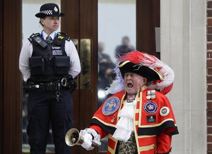 Town Crier Tony Appleton announces that the Duchess of Cambridge has given birth to a baby boy outside the Lindo wing at St Mary's Hospital in London London, Monday, April 23, 2018.