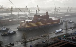 The floating nuclear power plant, the 'Akademik Lomonosov', is towed out of the St. Petersburg shipyard where it was constructed in St.Petersburg, Russia, Saturday, April 28, 2018.