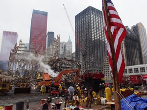  New York, NY, September 25, 2001 -- Teams of rescue workers using heavy machinery to clear the site of debris, continue to work around the clock. Photo by Mike Rieger/ FEMA News Photo     wnhires  (js1) 