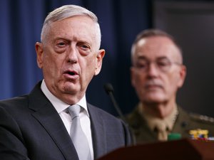 Defense Secretary Jim Mattis, joined by Joint Chiefs Chairman Gen. Joseph Dunford,  speaks during a news briefing at the Pentagon, Friday, April 13, 2018.