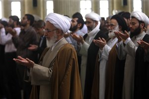 In this photo taken April, 27, 2009, Ayatollah Abdollah Javadi Amoli, a top cleric, leads noon prayer in Qom 120kms (72 miles) south of Tehran, Iran