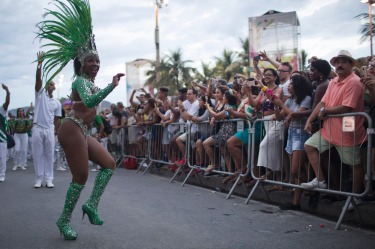 Members of a samba school parade along Copacabana Beach in Rio de Janeiro, Brazil. Musicians and members from Rio de ...