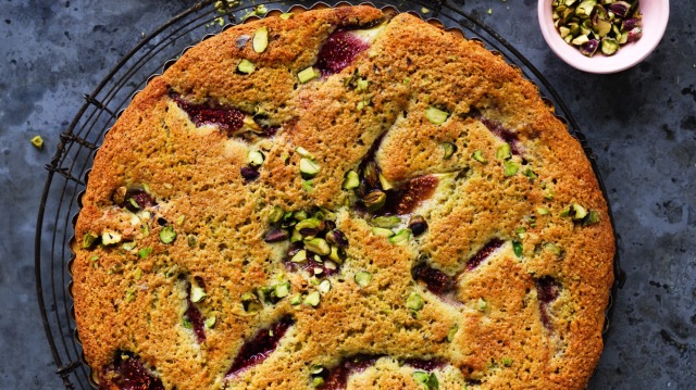 Bakewell tart dotted with pistachios and fresh fig wedges.