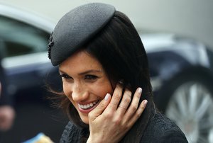 Britain's Prince Harry's fiancee Meghan Markle, leaves after attending a services commemorating Anzac Day at Westminster Abbey in London, Wednesday, April 25, 2018.