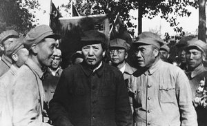 On a tour of Peiping, which he has selected as the capital of Red China, communist chief Mao Zedong (center, dark coat), greets a group of Communist army commanders, Gen. Chu Teh in Peiping, China, Sept. 18, 1949.