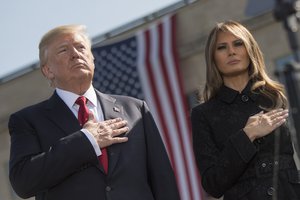 President Donald Trump and First Lady Melania Trump place their hands over their hearts during TAPS at the 9/11 Observance Ceremony at the Pentagon in Washington, D.C., Sept. 11, 2017. During the Sept. 11, 2001, attacks, 184 people were killed at the Pentagon.