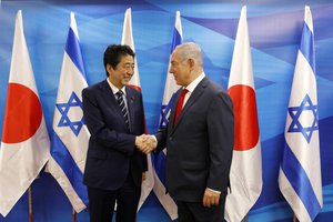 Israeli Prime Minister Benjamin Netanyahu (R) and Japanese Prime Minister Shinzo Abe, shakes hands during a photo op ahead of their meeting at the Prime Minister's Office in Jerusalem, Wednesday, May 2, 2018.