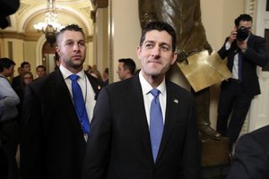 House Speaker Paul Ryan of Wis., center, leaves the House Chamber after voting yes on the Republican tax bill, Tuesday, Dec. 19, 2017, on Capitol Hill in Washington.