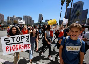 Hundreds of students walk out of school to rally against gun violence, Friday, April 20, 2018, downtown Los Angeles.