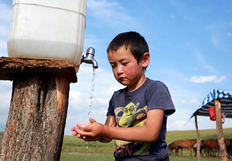 A boy in a nomadic camp in the Suusamyr Valley, Kyrgyzstan. Photo: EPA/IGOR KOVALENKO