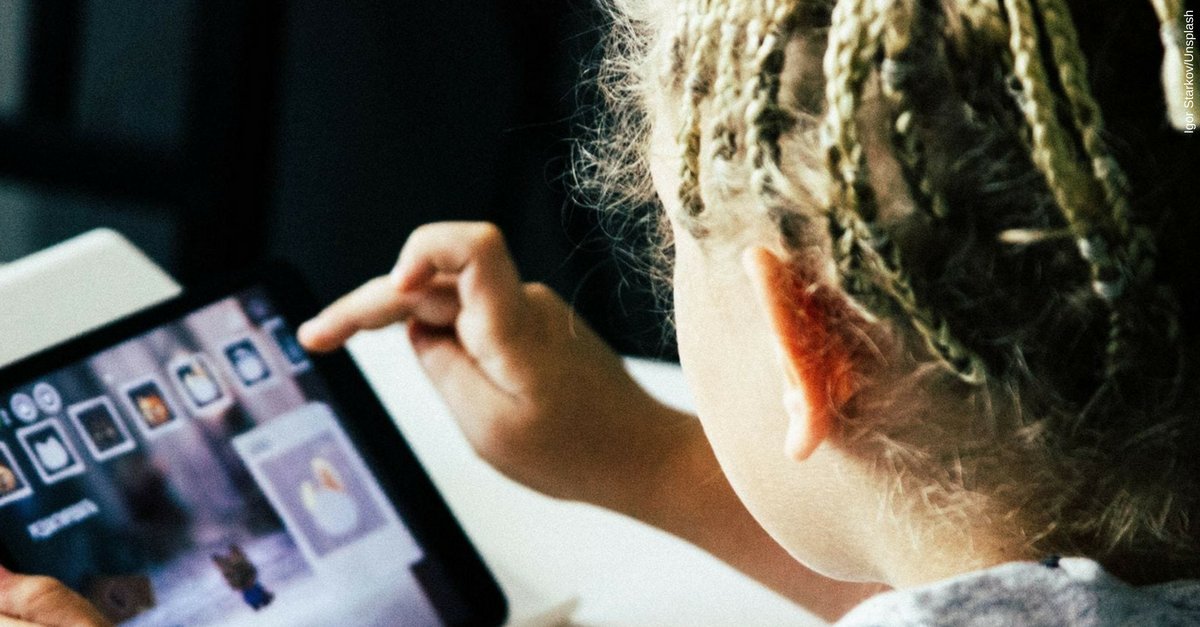 Young child busy with their laptop