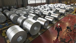 FILE - In this April 27, 2018 photo steel coils are stored at the Thyssenkrupp steel factory in Duisburg, Germany.