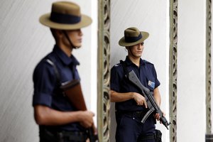 In this Friday, June 3, 2011, file photo, Gurkha police stand guard at the venue of a security summit held in Singapore. Singapore has a secure venue for high level talks. U.S. President Donald Trump will meet with North Korea's leader Kim Jong Un in Singapore on upcoming June 12, Trump announced in a Tweet Thursday May 10, 2018.