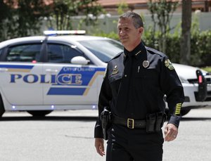 Orlando Police Chief John Mina arrives at an afternoon news conference during a hostage standoff Monday, June 11, 2018, in Orlando, Fla.