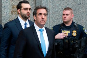 Michael Cohen, President Donald Trump's personal attorney, center, leaves federal court, Monday, April 16, 2018, in New York. (AP Photo/Mary Altaffer)