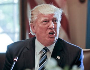 President Donald Trump answers a question from a member of the media during a luncheon with Argentine President Mauricio Macri in the Cabinet Room of the White House in Washington, Thursday, April 27, 2017.