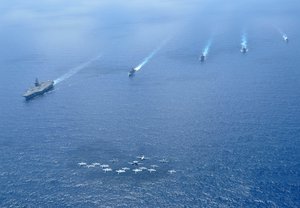 Ships and aircraft assigned to Carrier Strike Group (CSG) 11 operate in formation in the South China Sea.