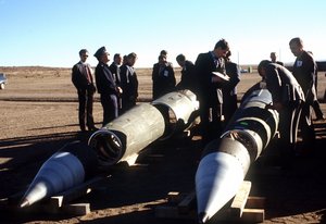  With their American escorts watching, Soviet inspectors record data from the side of a Pershing II missile prior to its destruction. Several missiles are to be destroyed in accordance with the Intermediate-Range Nuclear Forces (INF) Treaty