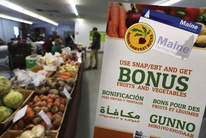 In this Friday, March 17, 2017 photo a sign advertises a program that allows food stamp recipients to use their EBT cards to shop at a farmer's market in Topsham, Maine. Republican governor Paul LePage and several Republican legislators nationwide say they hope that Republican President Donald Trump will support banning food stamps to purchase junk food like soda. (AP Photo/Robert F. Bukaty)