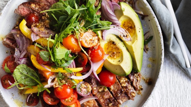 Adam Liaw's steak and avocado salad with fried garlic vinaigrette recipe.