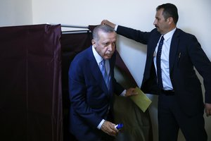 Turkey's President and ruling Justice and Development Party, or AKP, leader Recep Tayyip Erdogan comes out of a voting booth to cast his ballot in Turkey's elections at a polling station in Istanbul, Sunday, June 24, 2018.