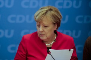 German Chancellor and chairwoman of the Christian Democratic Union party, Angela Merkel, arrives for a party board leaders' meeting at the headquarters in Berlin, Germany, Sunday, Nov. 20, 2016.