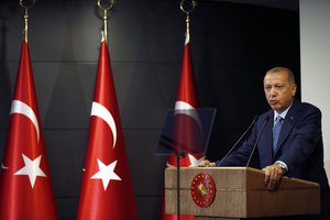 Turkey's President Recep Tayyip Erdogan delivers a statement on national television from his official residence in Istanbul