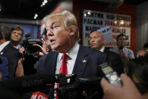 In this Saturday, Aug. 29, 2015, file photo, Republican presidential candidate Donald Trump answers questions from reporters at the National Federation of Republican Assemblies in Nashville, Tenn.