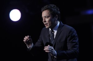 Jimmy Fallon is seen on stage during the inaugural NFL Honors show Saturday, Feb. 4, 2012, in Indianapolis.The New York Giants will face the New England Patriots in the NFL football's Super Bowl XLVI in Indianapolis on Feb. 5. (AP Photo/Charlie Riedel)