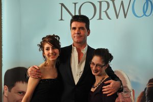 Simon Cowell with a Norwood service user at the annual dinner 2010