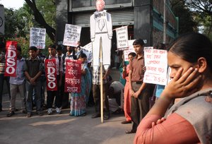 An activist of All India Democratic Students' Organization (DSO) shouts slogans during a protest, in Kolkata, India, Wednesday, Dec. 19, 2012. The hours-long gang-rape and near fatal beating of a 23-year-old student on a bus in New Delhi triggered outrage and anger across the country Wednesday as Indians demanded action from authorities who have long ignored persistent violence and harassment against women