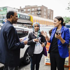 File - This May 6, 2018 photo provided by the Alexandria Ocasio-Cortez Campaign shows candidate Alexandria Ocasio-Cortez, right, during a Bengali community outreach in New York.