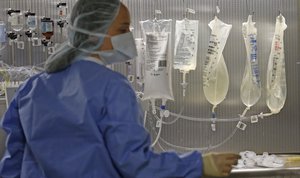 In this Friday, June 1, 2018, photo, a pharmacy technician is shown in the sterile medicines area of the inpatient pharmacy at the University of Utah Hospital in Salt Lake City.