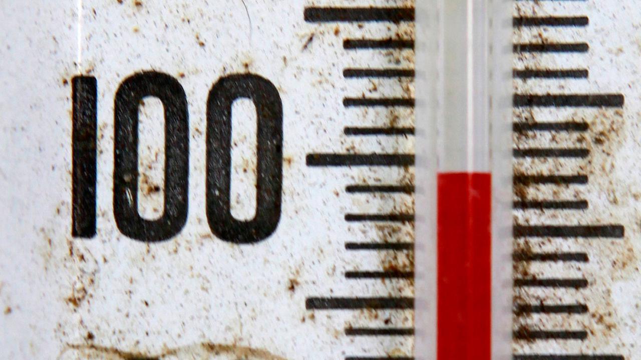 A thermometer records just below 100 degrees in a north Seattle neighborhood Wednesday afternoon, July 29, 2009. 