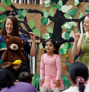 Presenters and child performing at storytime