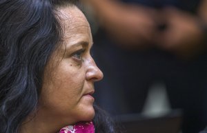 Suspect Beate Zschaepe arrives for the verdict in the court in Munich, southern Germany, Wednesday, July 11, 2018.