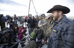 Ammon Bundy, one of the sons of Nevada rancher Cliven Bundy, speaks to reporters during a news conference at Malheur National Wildlife Refuge Wednesday, Jan. 6, 2016, near Burns, Oregon.