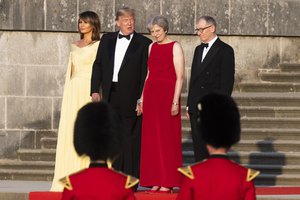 From left, first lady Melania Trump, President Donald Trump, British Prime Minister Theresa May, and her husband Philip May, watch the arrival ceremony at Blenheim Palace, in Blenheim west of London, England, Thursday, July 12, 2018.