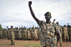 Soldiers cheer at a ceremony marking the 34th anniversary of the Sudan People's Liberation Army (SPLA), attended by President Salva Kiir, in the capital Juba, South Sudan, Thursday, May 18, 2017.