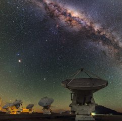 File - This view shows several of the ALMA antennas in the Atacama Desert, with the central regions of the Milky Way above.  The Atacama Desert is a plateau in South America, primarily in Chili, covering a 1000-km (600-mi) strip of land on the Pacific coast.